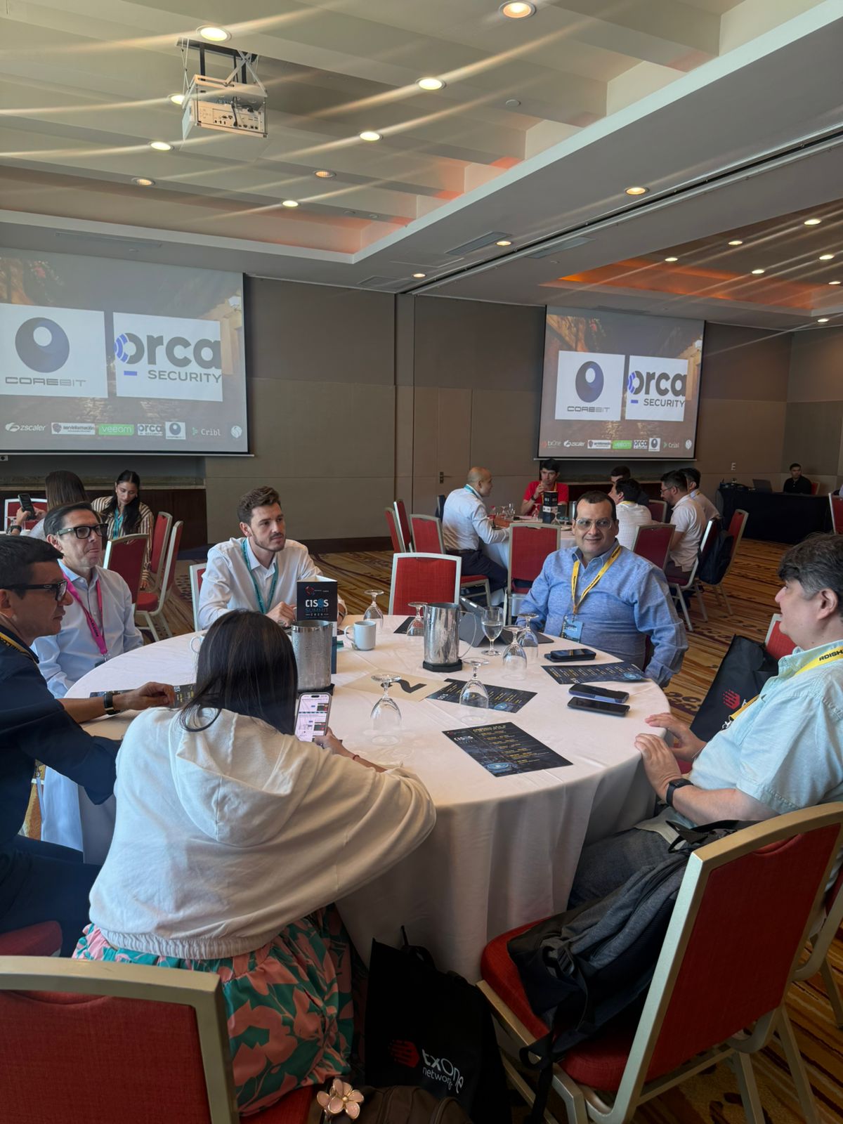 Delegates deliberating cross-border threat mitigation at Table 02