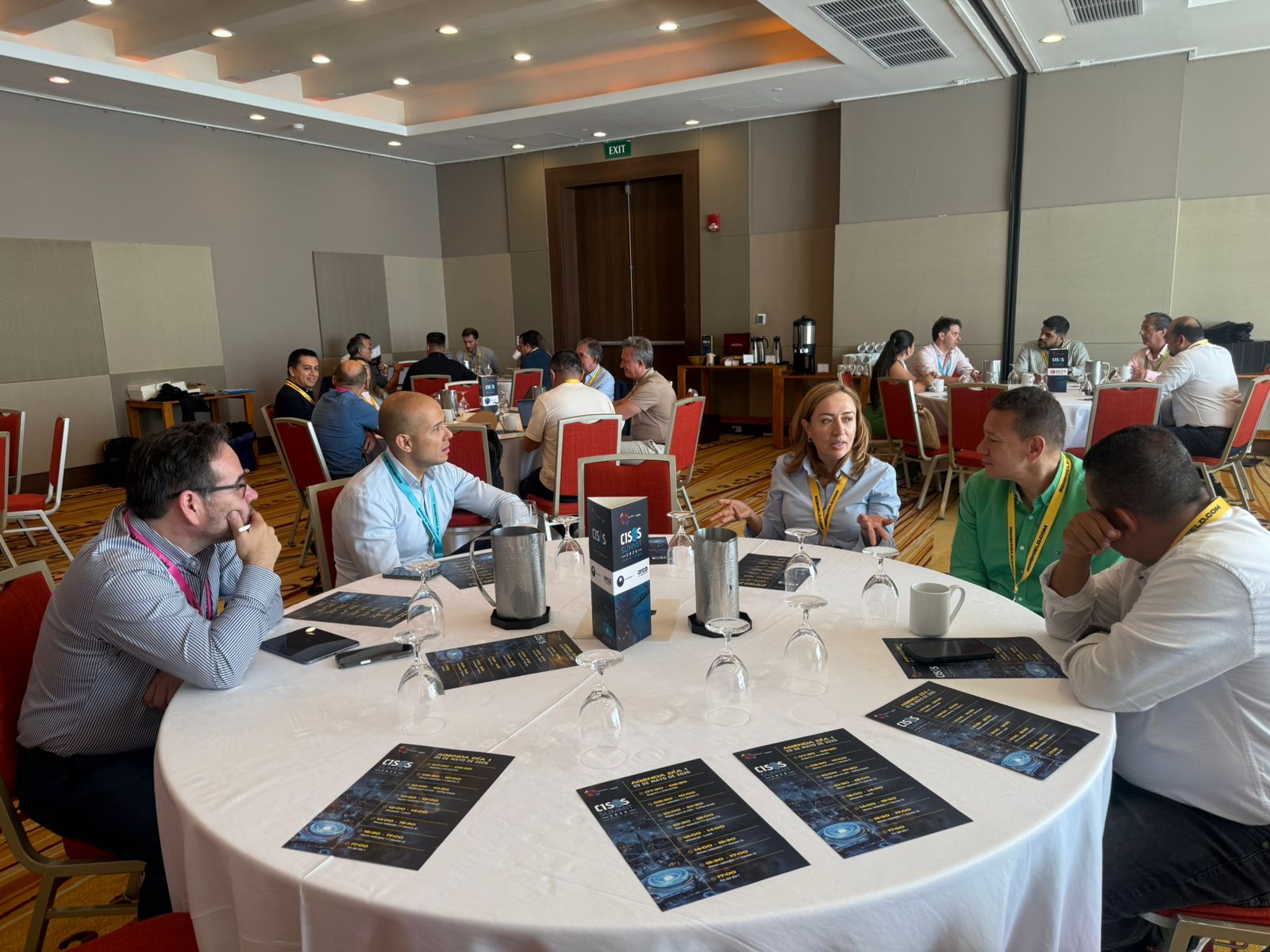 CISO peers conversing and synthesizing summit consensus takeaways